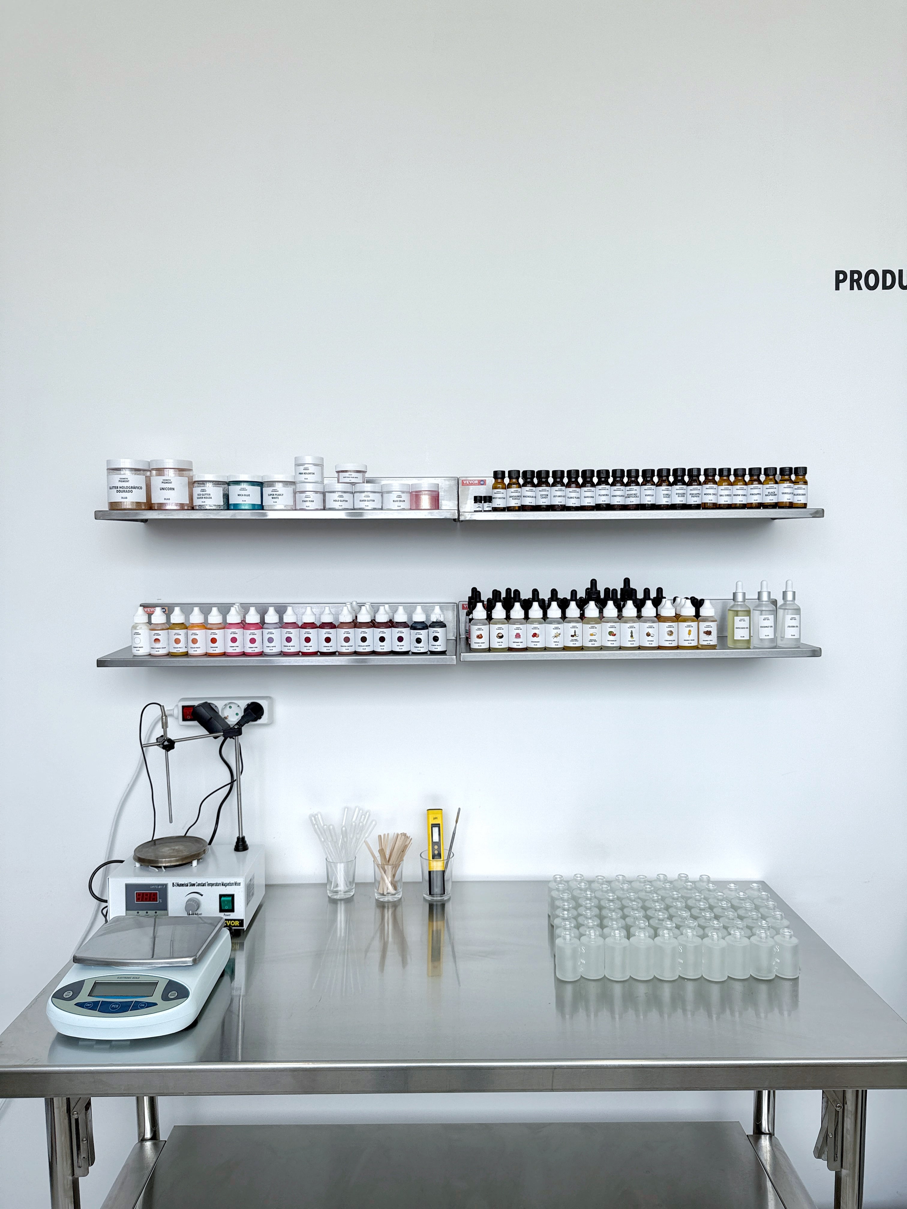 Laboratory setup for lip gloss and face serum cosmetics production.